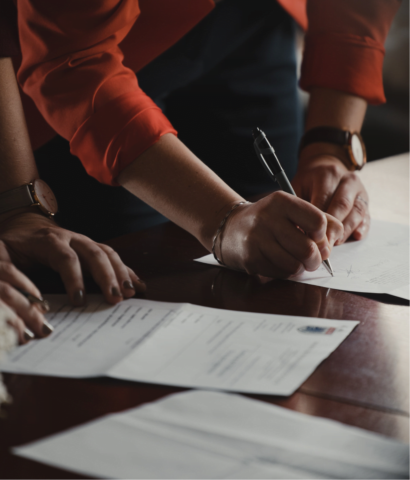 people-signing-paper